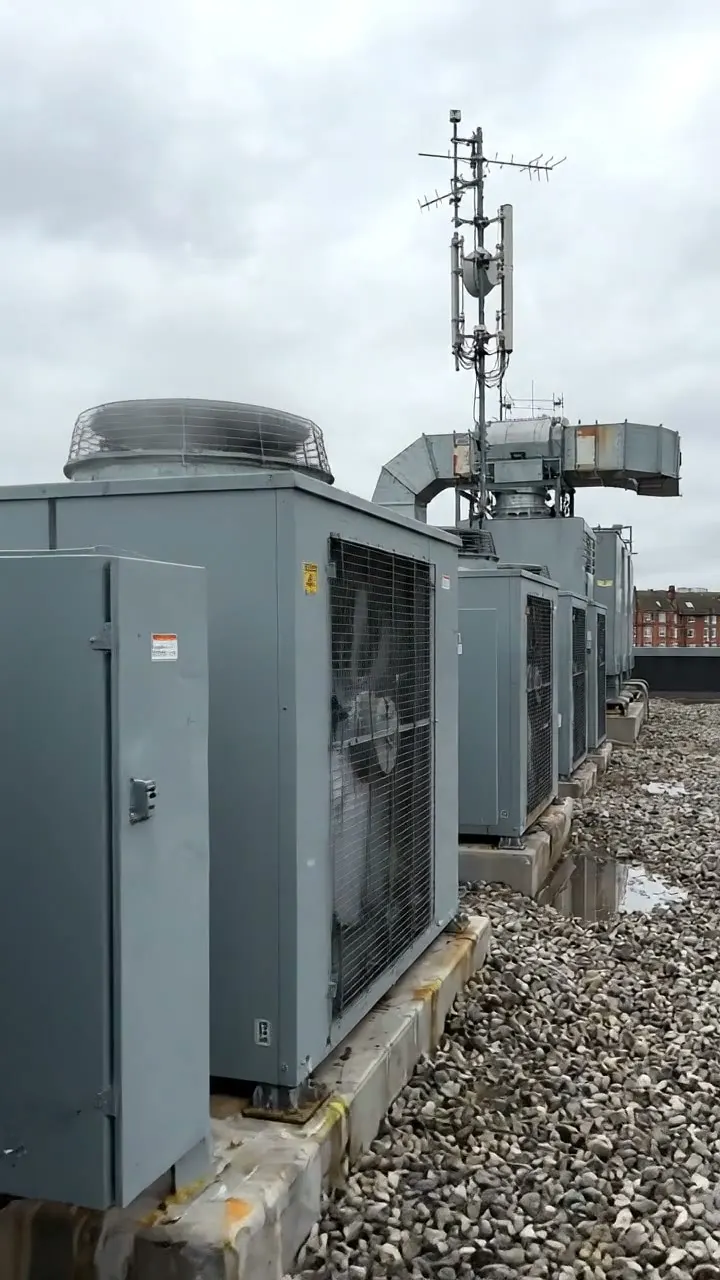 A roof condenser with leaf and pollen build-up across its coil fins