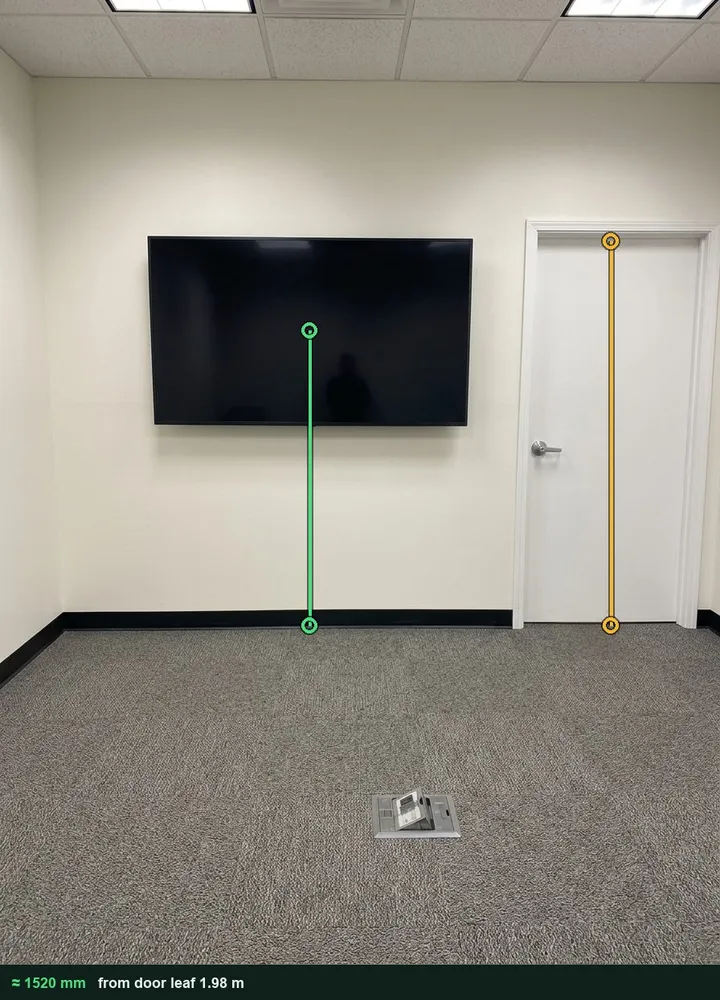 A meeting room screen with the door marked as the reference and the floor to the centre of the screen measured at about 1520 mm