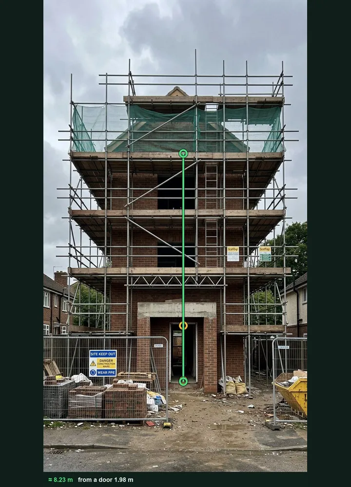 A scaffolded block of flats marked up in Measure from photo: an amber line on the ground floor doorway and a green line to the top working lift, about 8.23 m