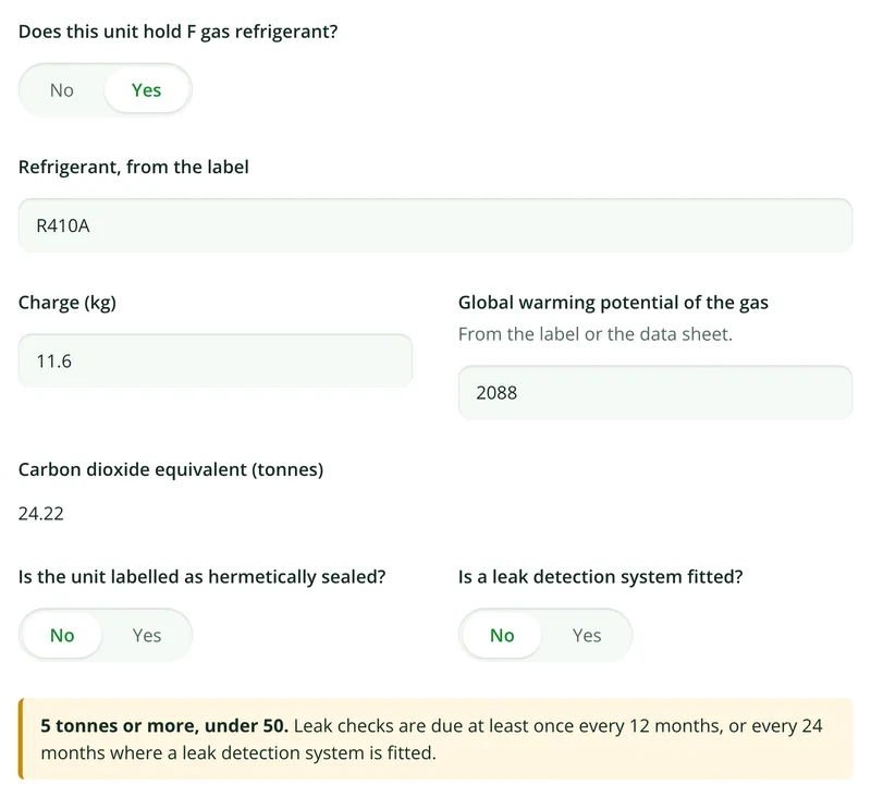 A VRF unit holding R410A with a charge of 11.6 kg and a GWP of 2088, the form showing 24.22 tonnes of carbon dioxide equivalent and the 12 month leak check band
