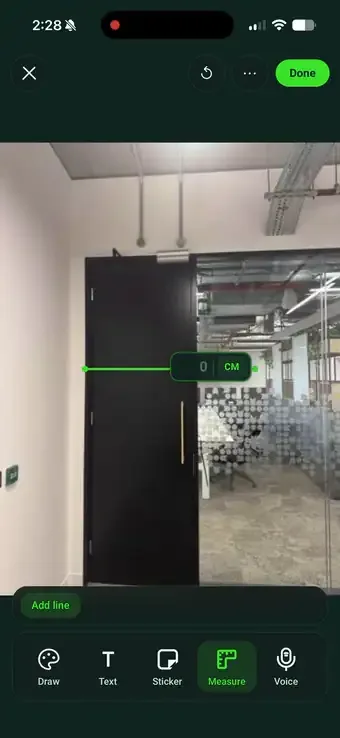 Drawing a measurement line down a door on a site photo in SiteSurvey and keying in the value on a numeric keypad