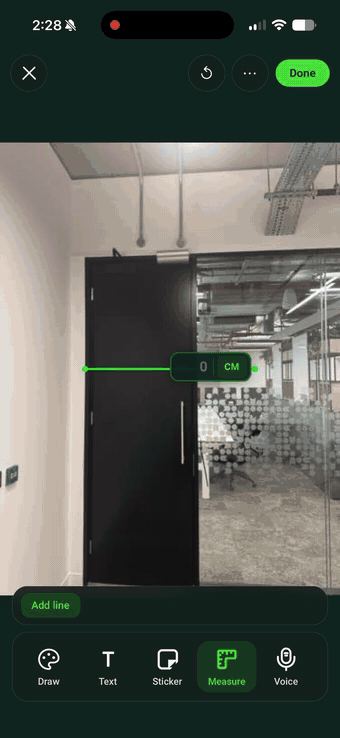 Drawing a measurement line down a door on a site photo in SiteSurvey and keying in the value on a numeric keypad