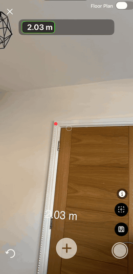 Capturing a 1.00m width across a doorway in augmented reality, with both measurements shown in the room