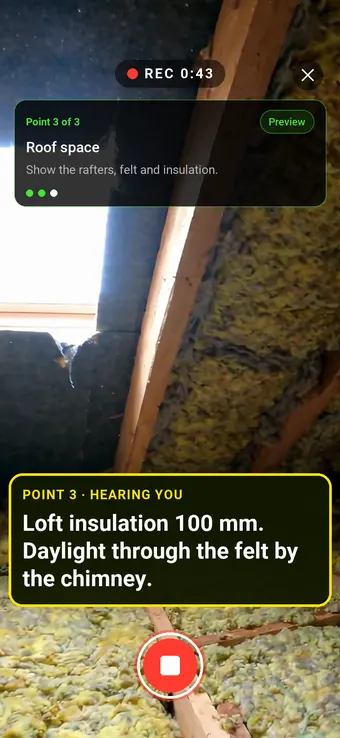 A loft space with rafters, insulation and daylight through the felt, with the Walk Cam point card and live transcription
