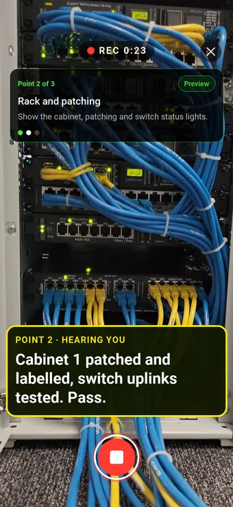 A network cabinet with dressed patch cables, with the Walk Cam point card and live transcription