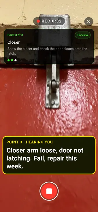 An overhead closer on a red fire door, with the Walk Cam point card and live transcription