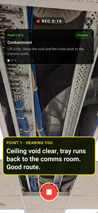 A lifted ceiling tile showing a cable tray in the void, with the Walk Cam point card and live transcription
