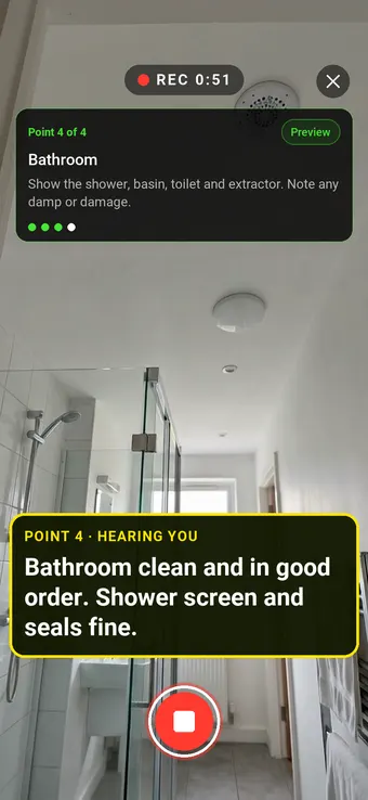 A clean rented flat bathroom with a shower enclosure, with the Walk Cam point card and live transcription
