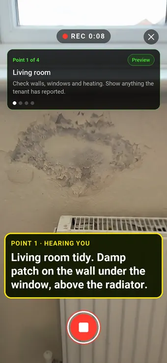 Walk Cam recording a damp patch on a rented flat's living room wall, with the point card and the live transcription on screen