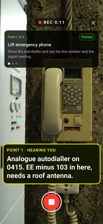 A lift emergency autodialler in a motor room filmed in Walk Cam, with the point card and the engineer's live transcription