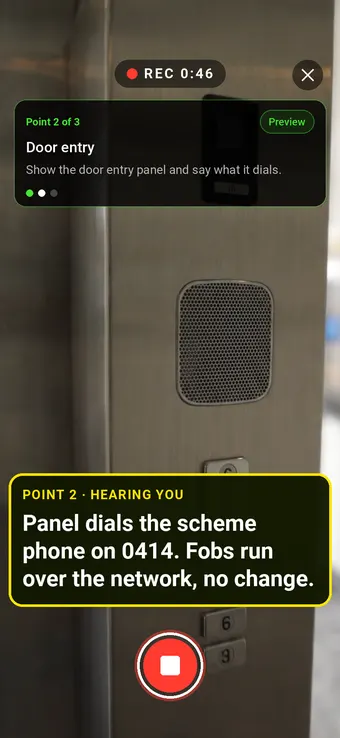 A door entry panel in a block of flats entrance filmed in Walk Cam, with the point card and live transcription