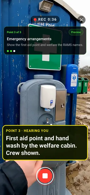 A site welfare cabin with a first aid sign and hand wash station, with the Walk Cam point card and live transcription