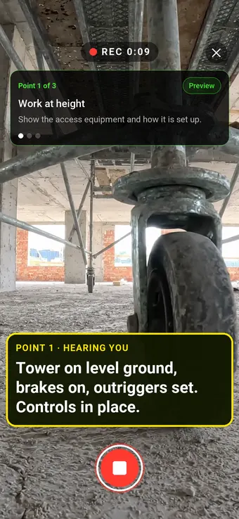 A mobile scaffold tower with brakes and outriggers set, filmed with SiteSurvey Walk Cam while live voice-to-text writes the work at height note into the assessment
