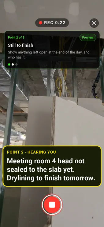 A plasterboard partition with its head still open to the slab, with the Walk Cam point card and live transcription