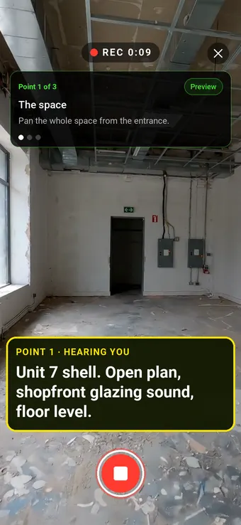 An empty retail unit before fit-out, with the Walk Cam point card and live transcription