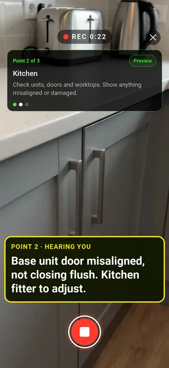 A misaligned kitchen cupboard door, with the Walk Cam point card and live transcription