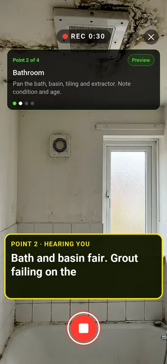 A social housing bathroom with failing grout and ceiling mould, with the Walk Cam point card and live transcription