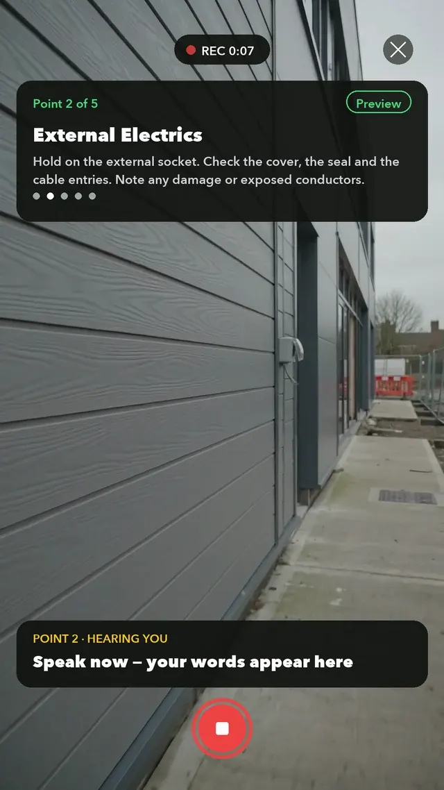 Walk Cam recording an inspection point: the prompt reads External Electrics, and the spoken answer types itself live — socket cover smashed, conductors exposed, isolate it and get it replaced today